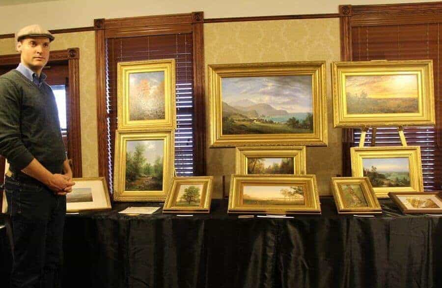 Man Infront of Mohonk Painting Display