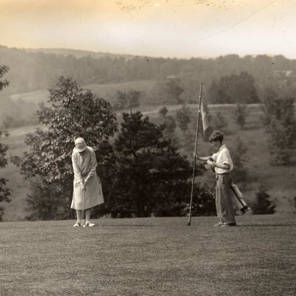 Lady Playing Golf with Caddy 1920s