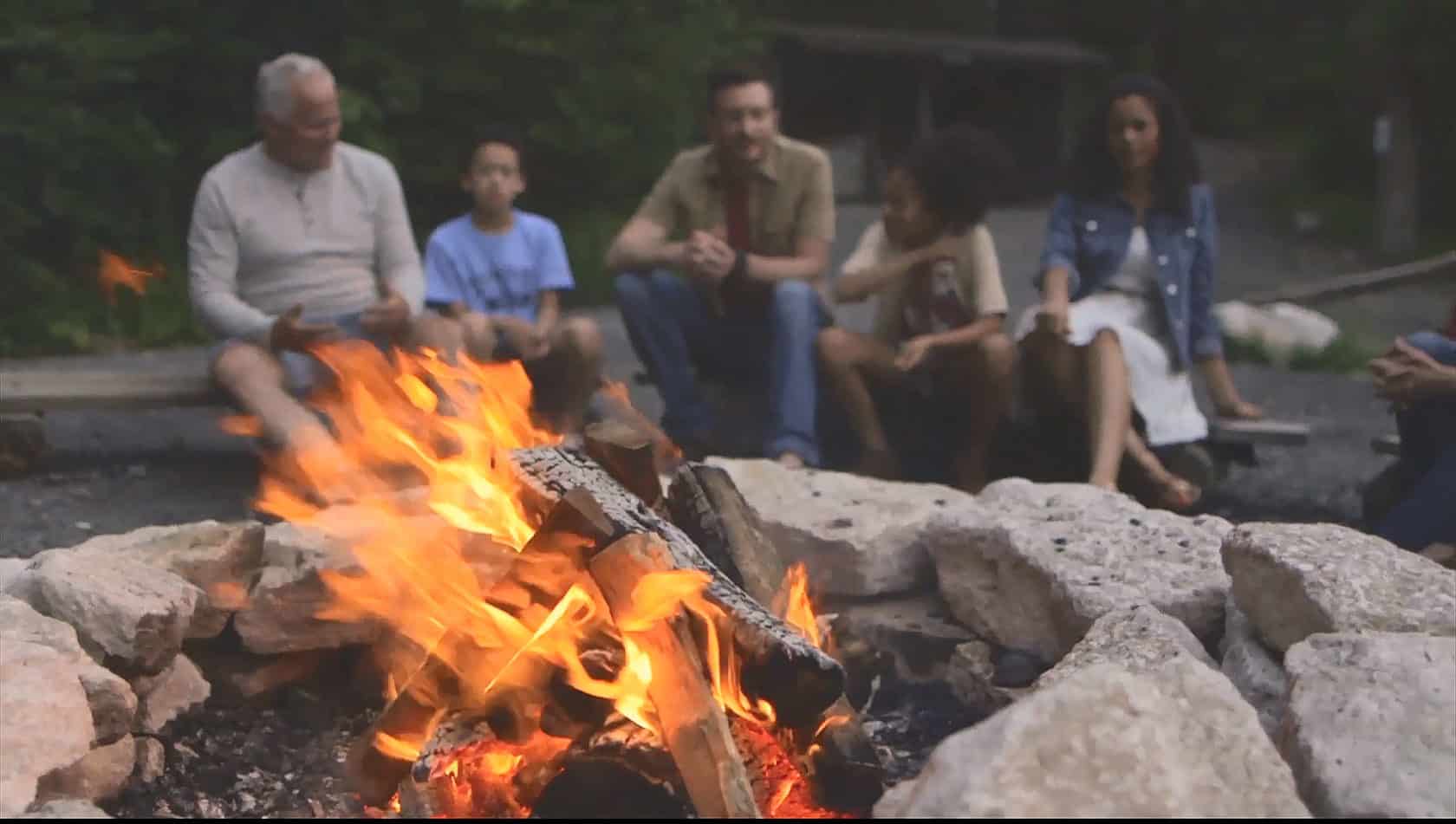 family around campfire