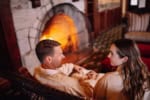 Couple Relaxing in Front of a Fireplace at Mohonk
