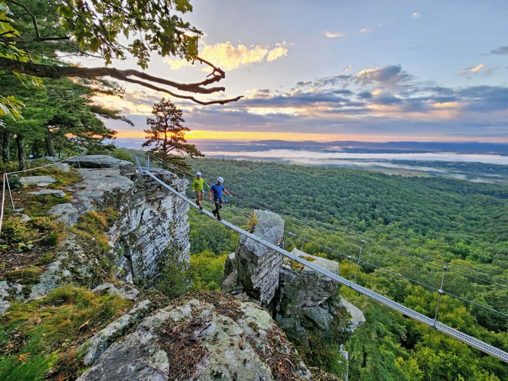 Person on the Pinnacle Ledge Tour at Sunrise