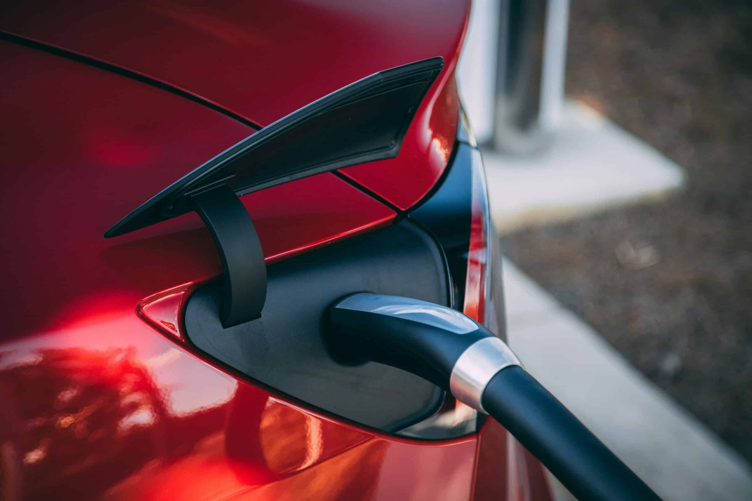 EV Charger Plugged Into a Red Car