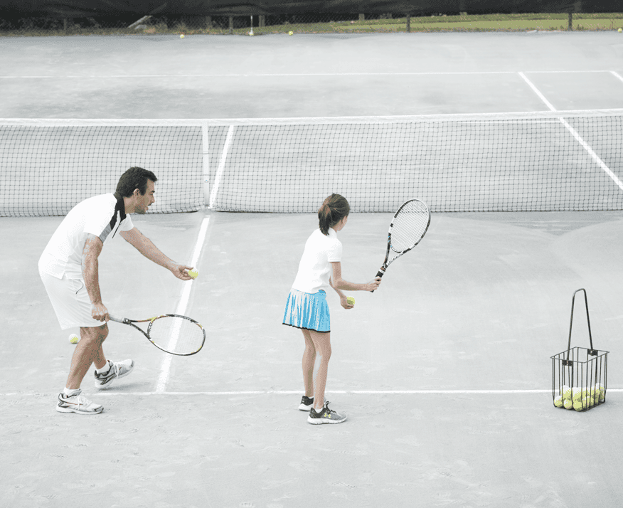 Man and Young Girl Practicing Tennis at Mohonk