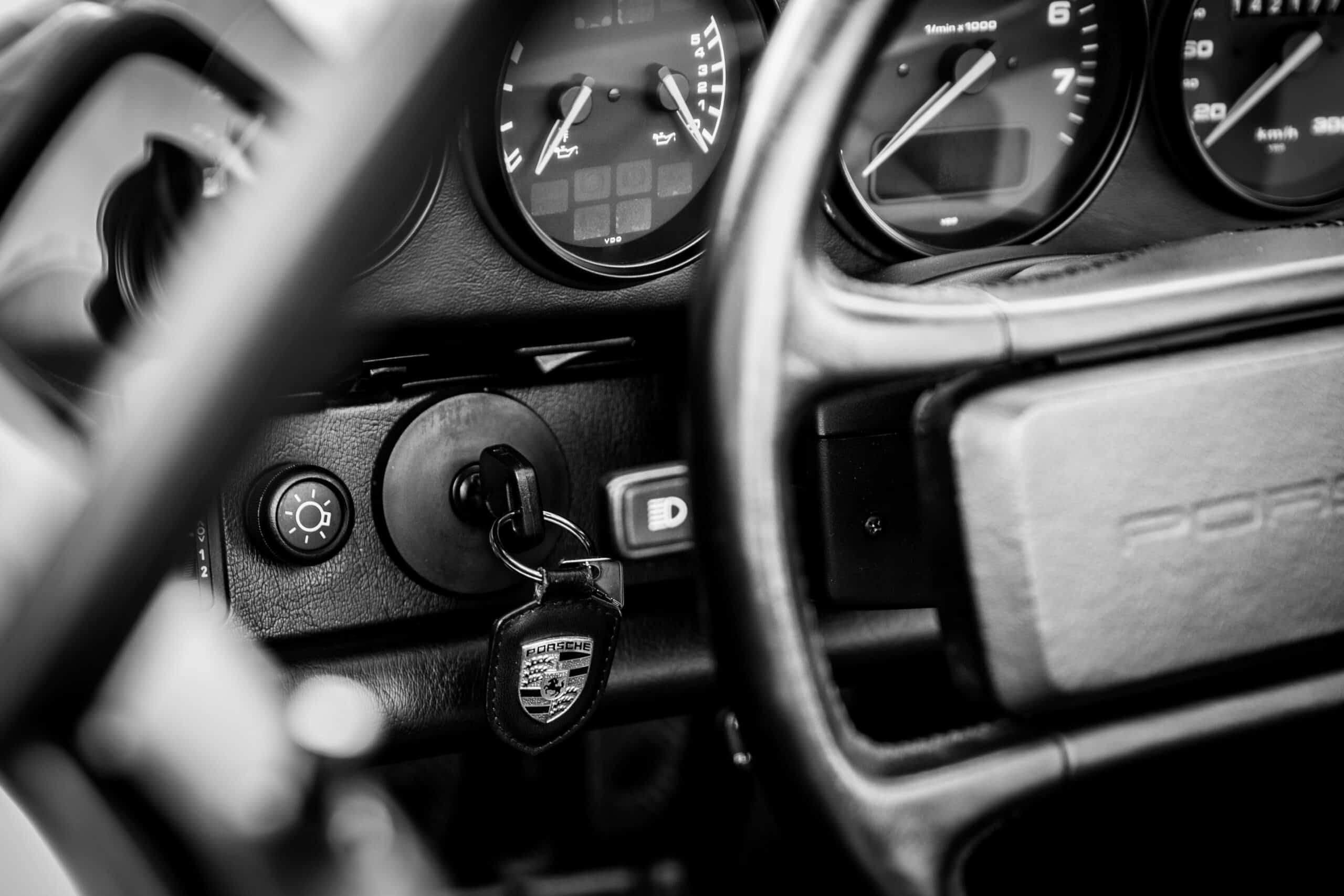 Steering Wheel and Key in the Ignition of a Car