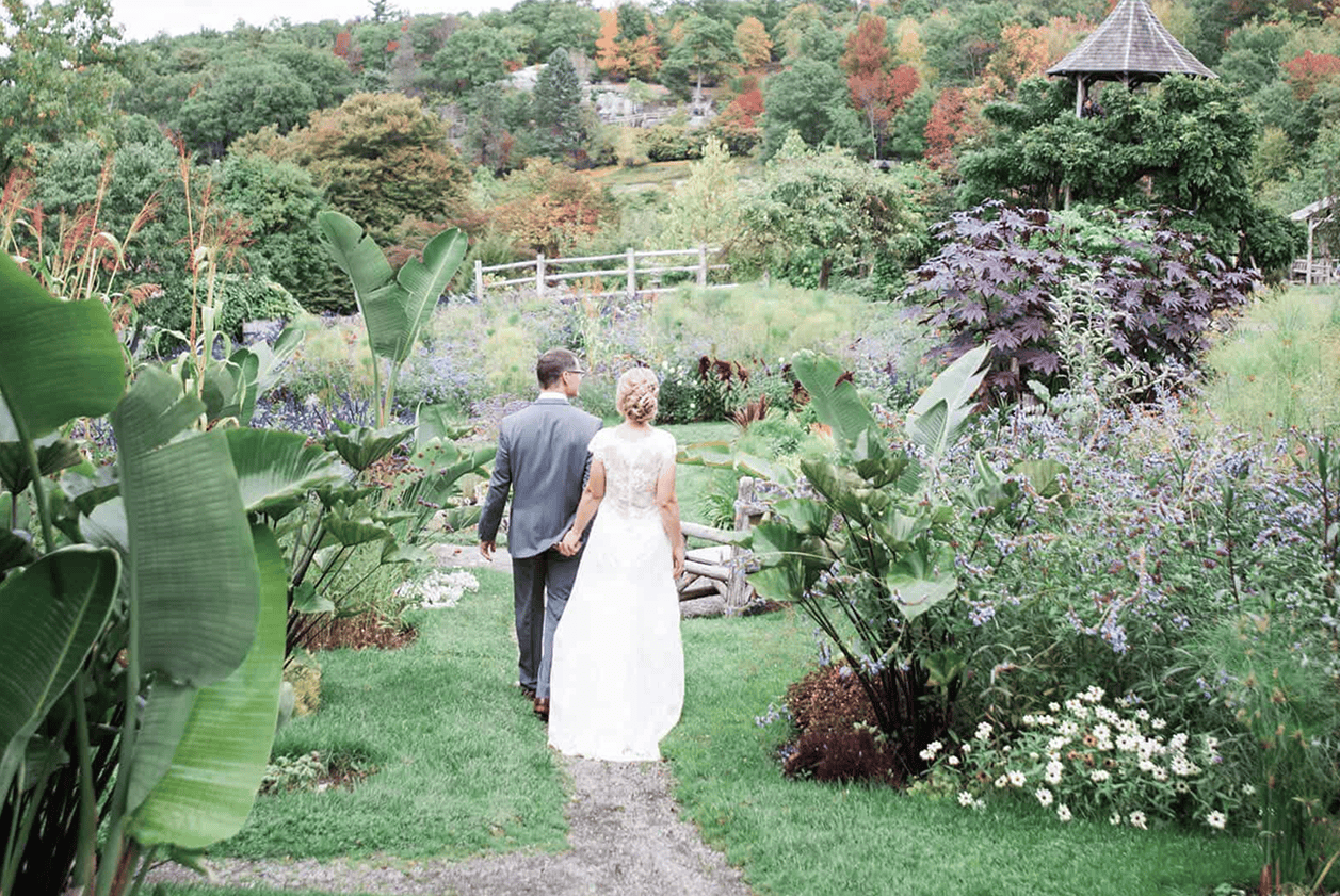 Wedding Photo of Brynn and Jeff Strolling Through Mohonk Mountain House's Garden