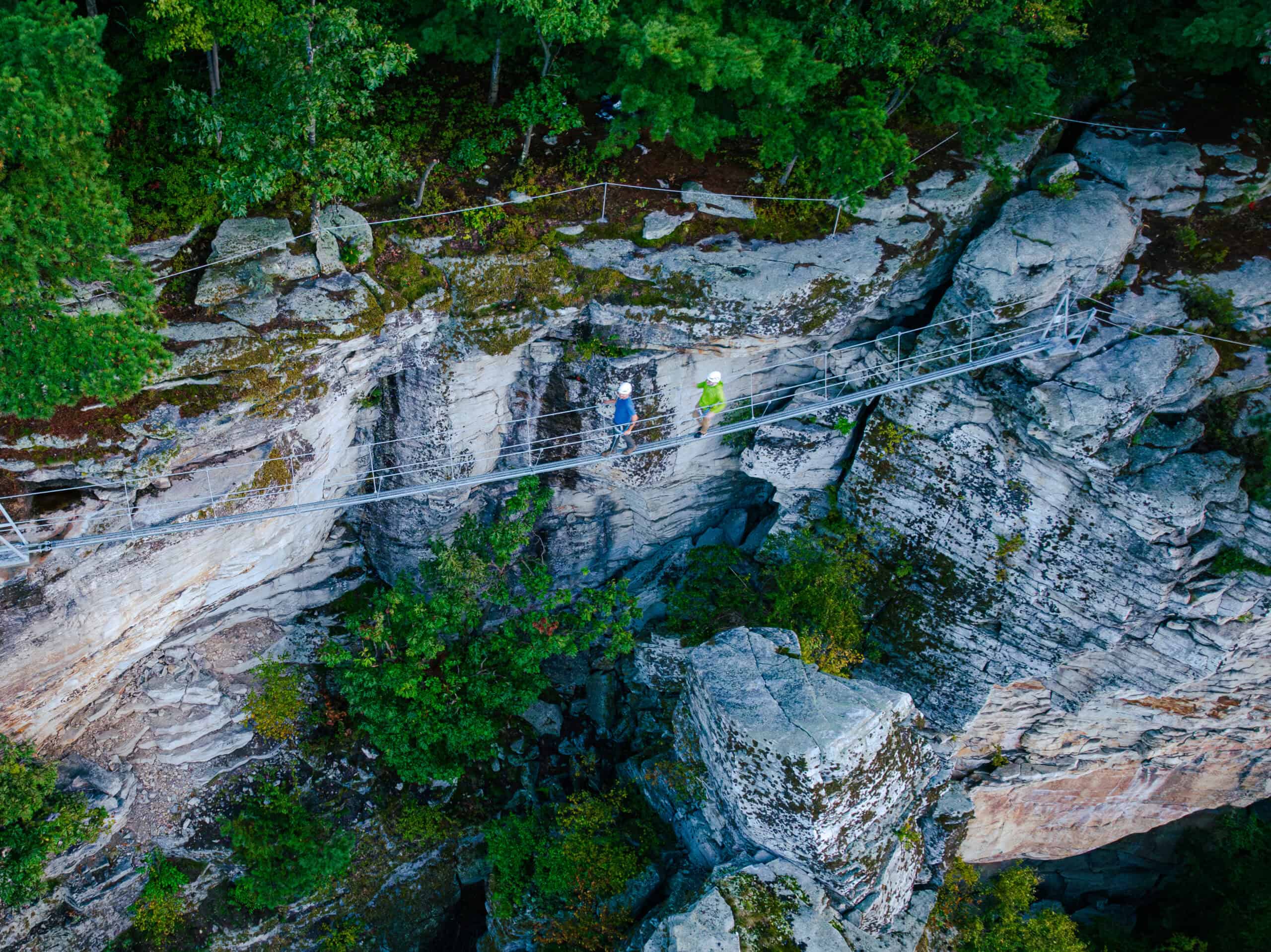Aerial View of People Challenging Themselves to the Pinnacle Ledge Tour