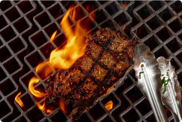 Steak on a Hardwood-Fired Grill for a Farm to Table Dinner at Our New York Resort