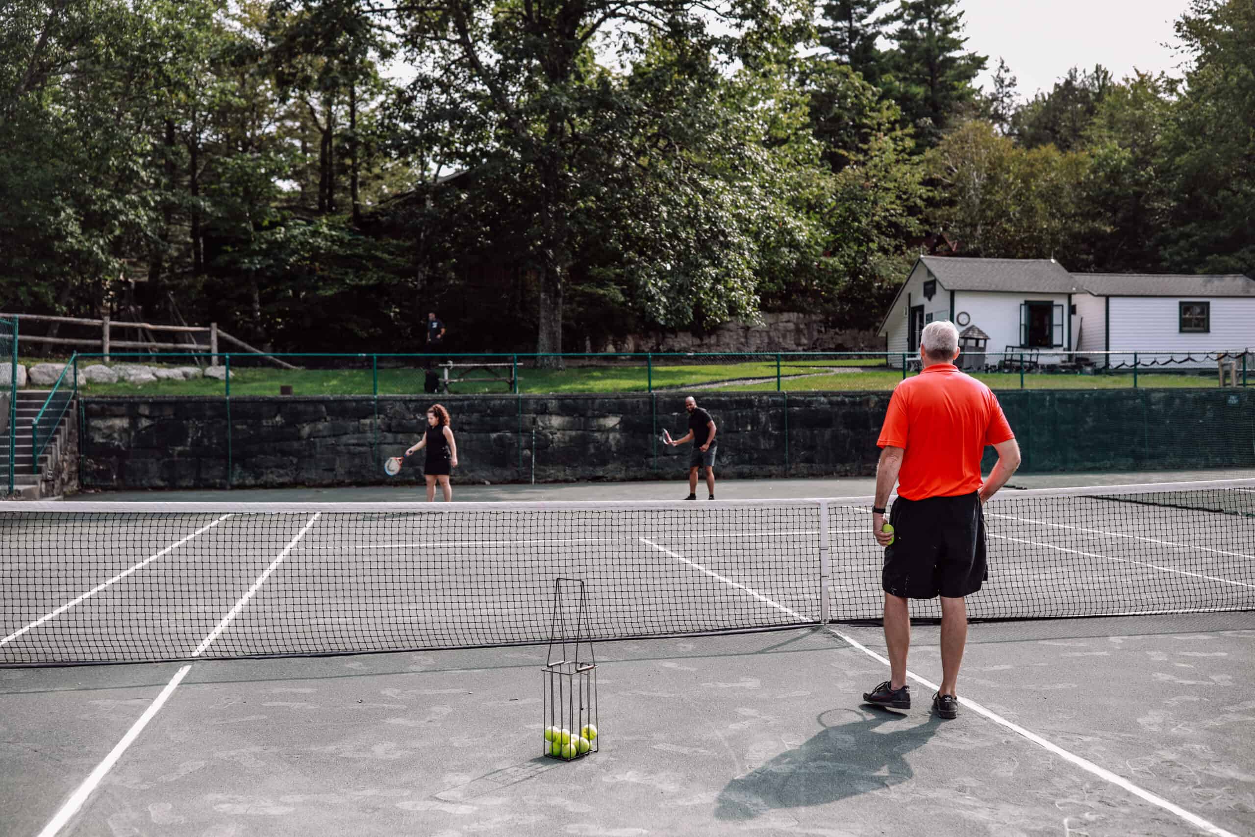 People in a Beginner's Tennis Clinic at Our New Paltz Resort
