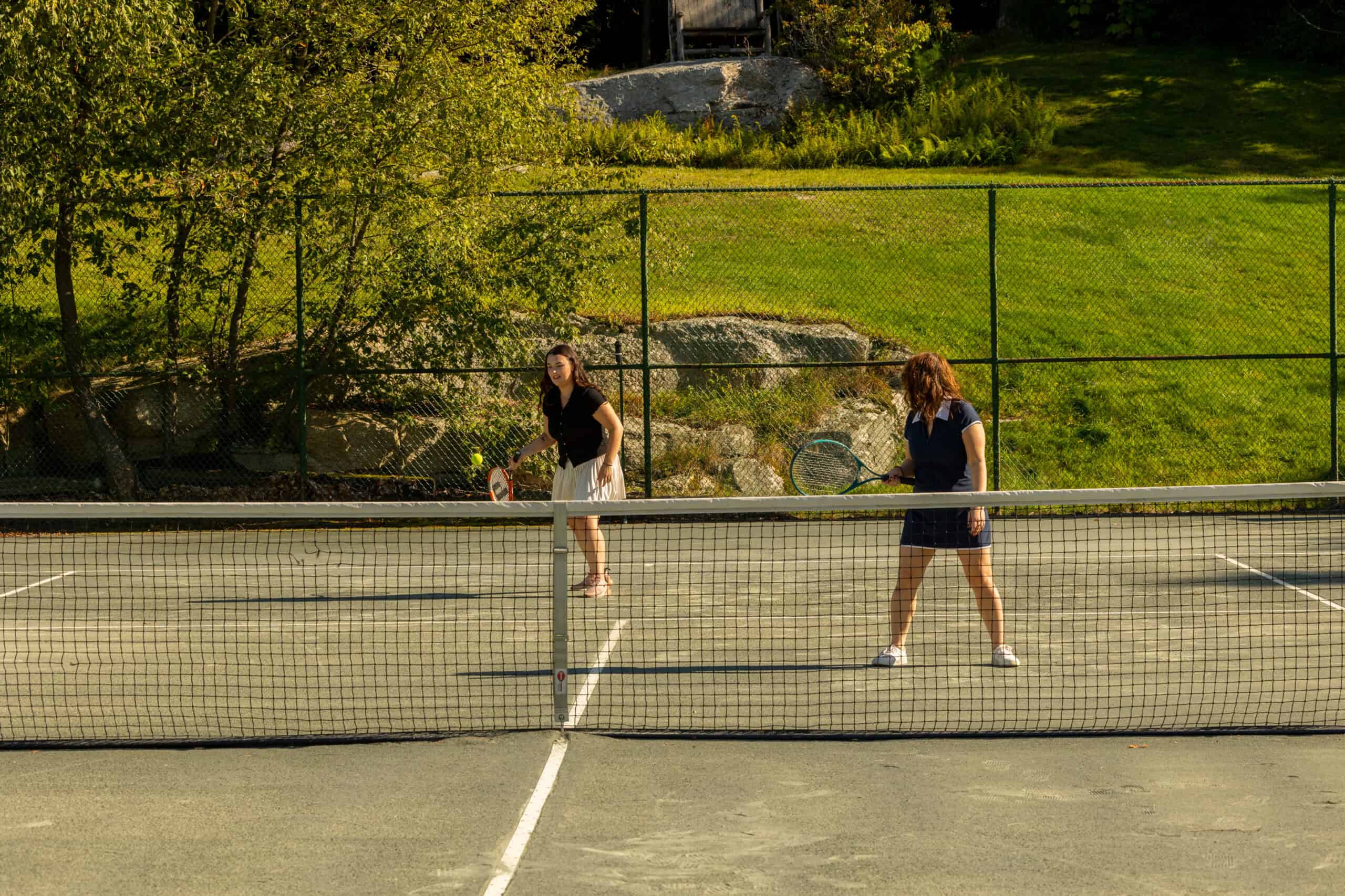 People Playing Doubles Tennis
