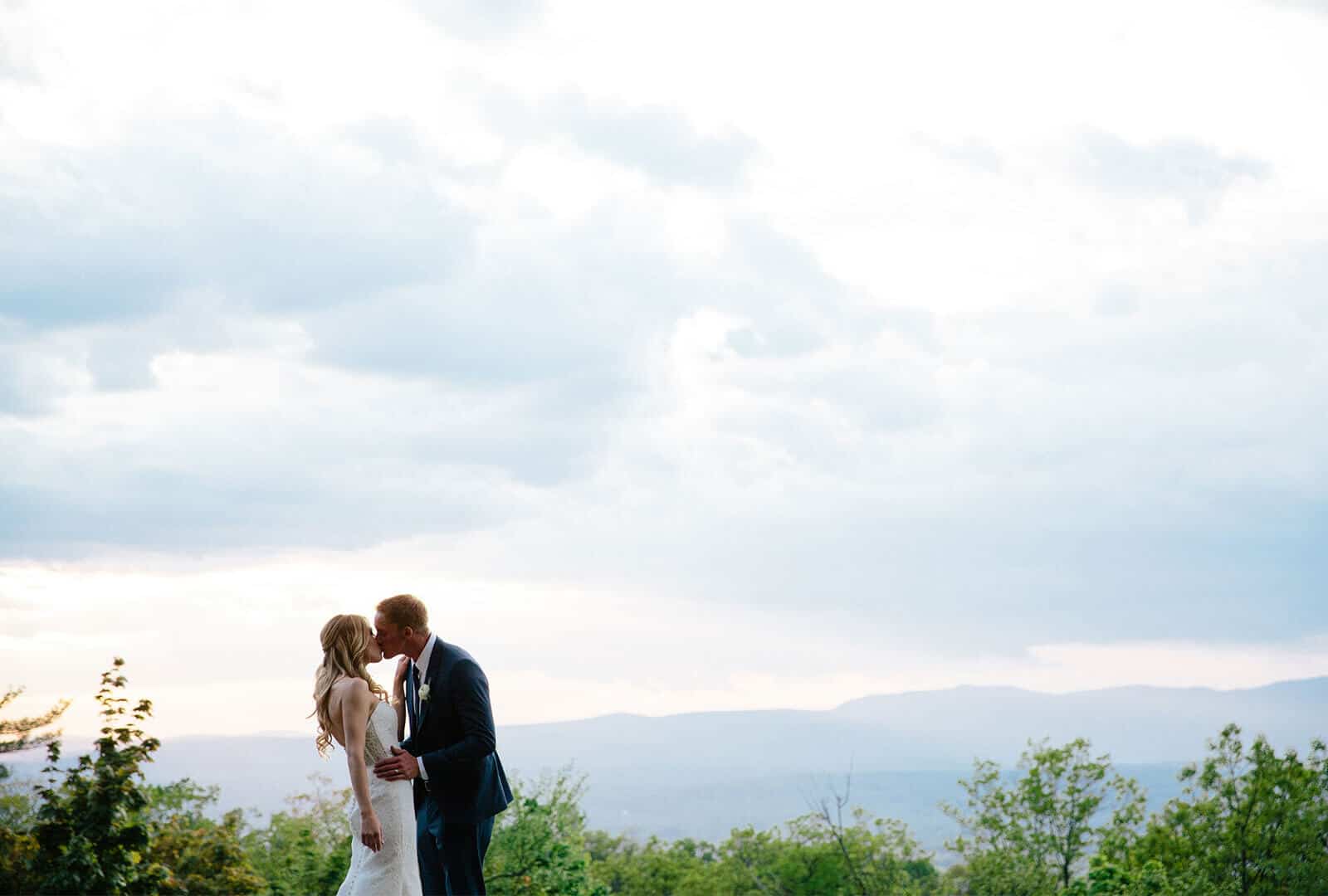Wedding Photo of Kelly and Nick Sharing a Kiss