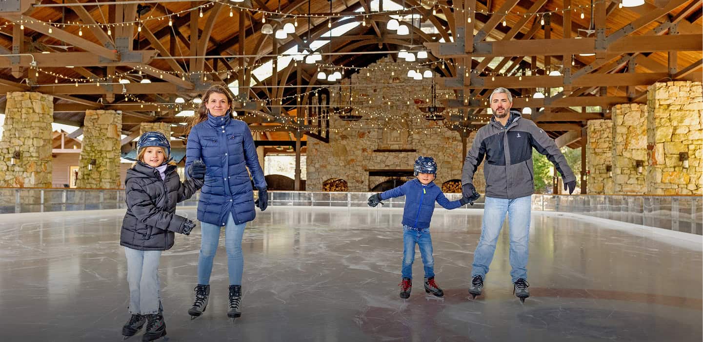 Family of Four Ice Skating at Our Hudson Valley, Family Resort